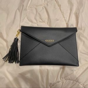 Guess Envelope Clutch with phone charger tassel